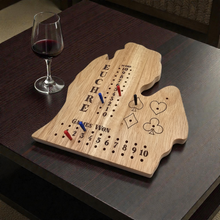 Load image into Gallery viewer, Wooden Euchre board with game pieces on a dark surface next to a glass of red wine.