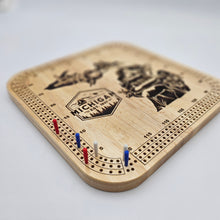 Load image into Gallery viewer, Wooden Michigan cribbage board with pegs on a light gray background
