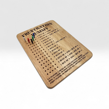 Load image into Gallery viewer, Wooden game board with text and pegs on a white background
